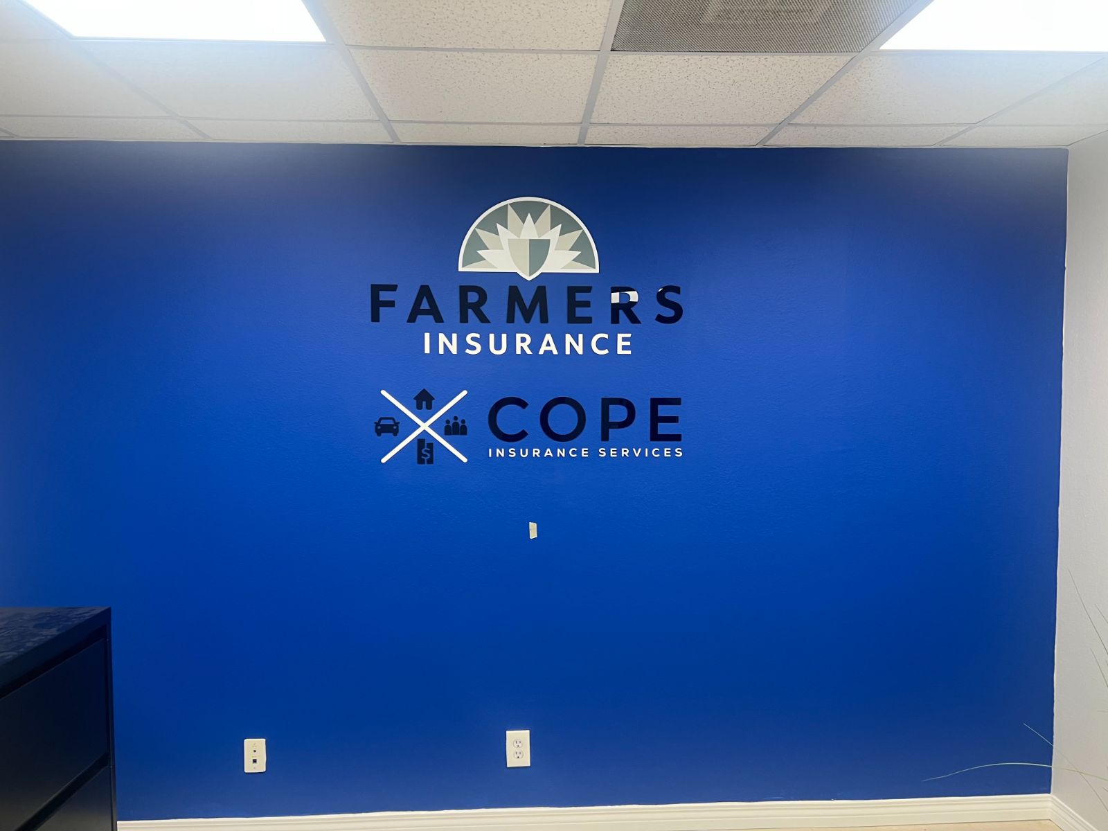 Royal-blue office wall with a Farmers Insurance logo and dimensional letters above a Cope Insurance Services logo, all in dimensional acrylic, installed by Hi Sign, Brea, CA