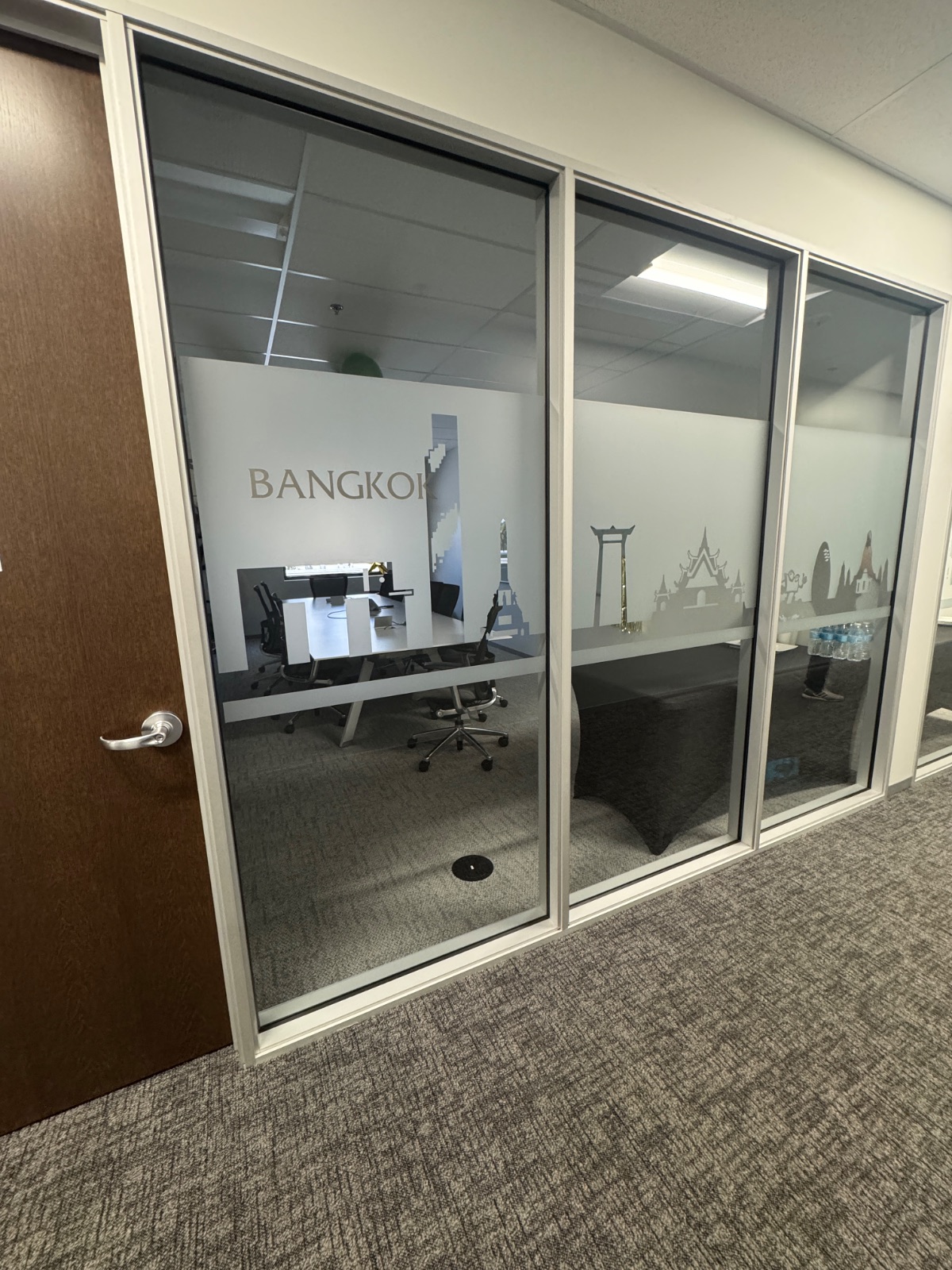 Bangkok room front from the opposite approach, frosted privacy film aligned across each glass panel, installed by Hi Sign, Brea, CA