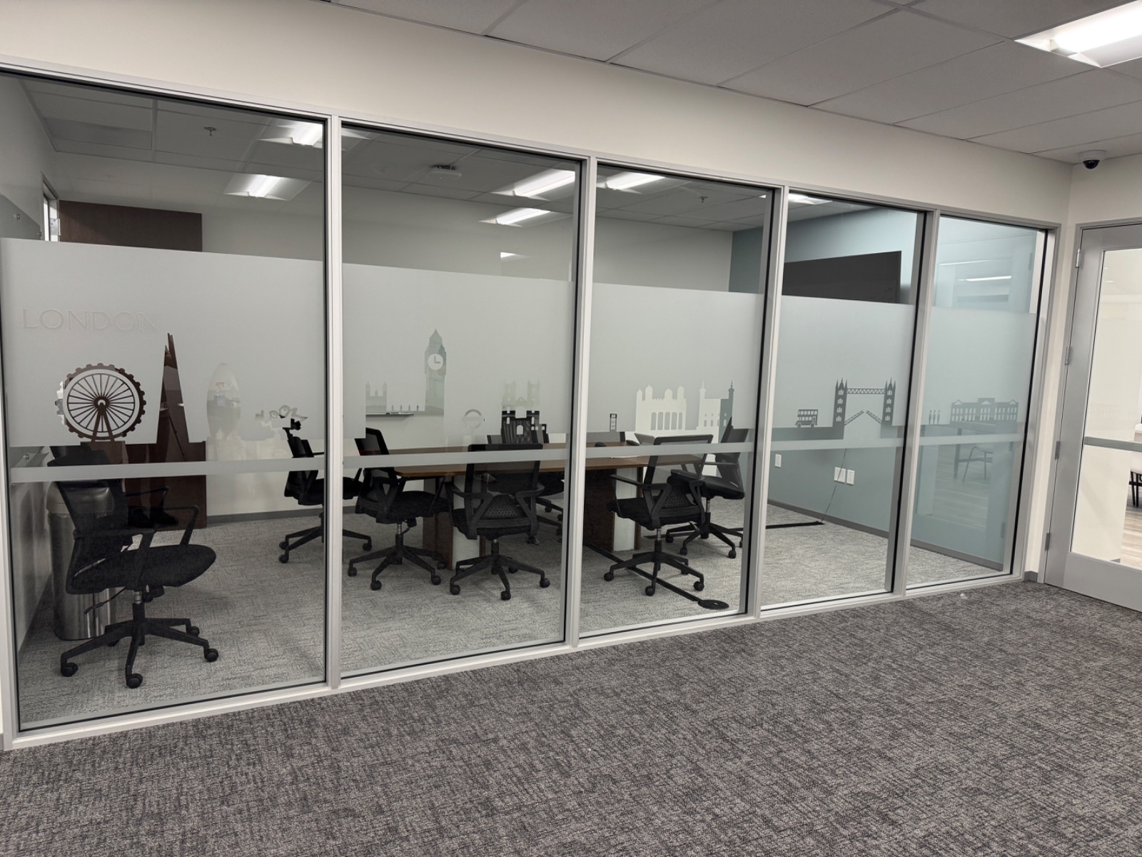 Interior view of the London meeting room glass, cut-vinyl landmarks reading correctly from inside the room, installed by Hi Sign, Brea, CA