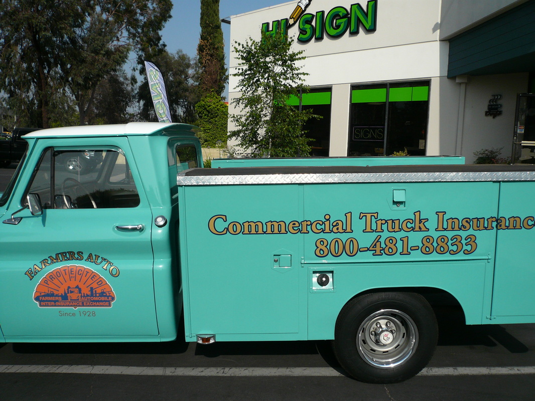 Restored turquoise service truck parked outside the shop with gold cut-vinyl lettering reading 'Commercial Truck Insurance' and a phone number on the utility bed, and a Farmers Auto seal on the door, installed by Hi Sign, Brea, CA